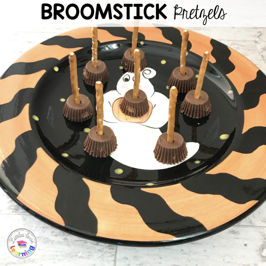 Broomsticks made out of pretzel sticks and mini Reeses peanut butter cups. Inspired by Room on the Broom by Julia Donaldson.