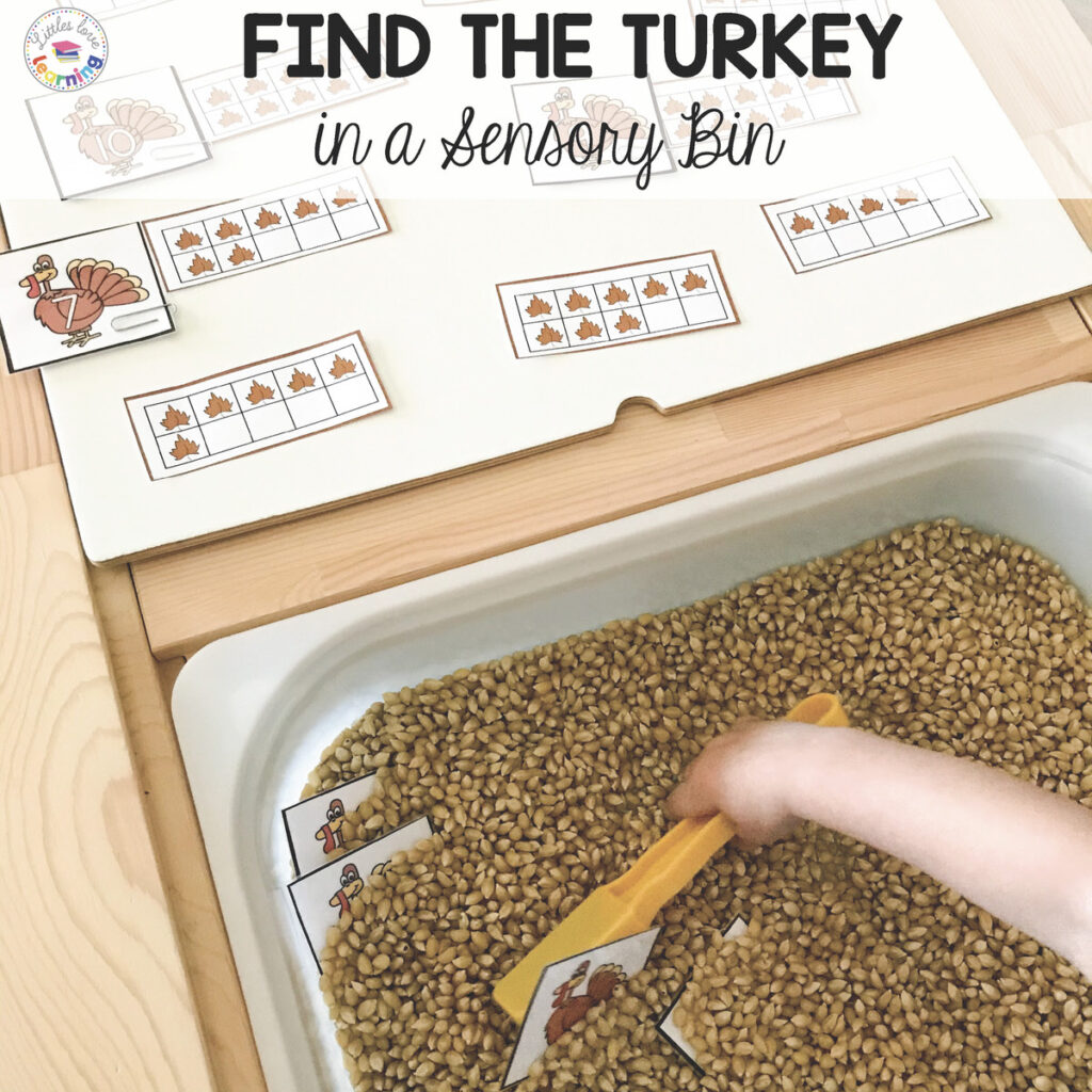 Find the Turkey Preschool Thanksgiving Game (free download) in a corn sensory bin